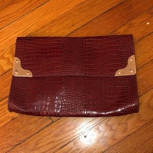 Snake skin maroon clutch